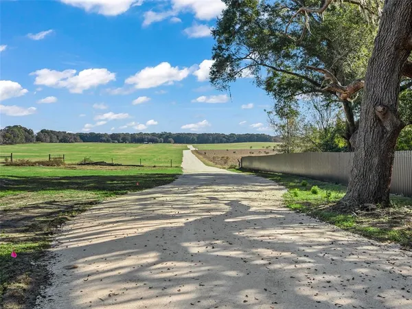a view of a street with a building in the background