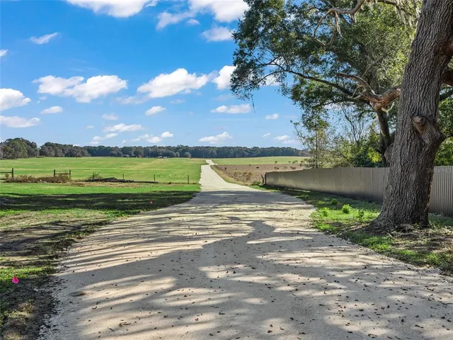 a view of a street with a building in the background