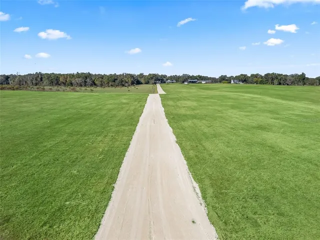 a view of a lake with a big yard