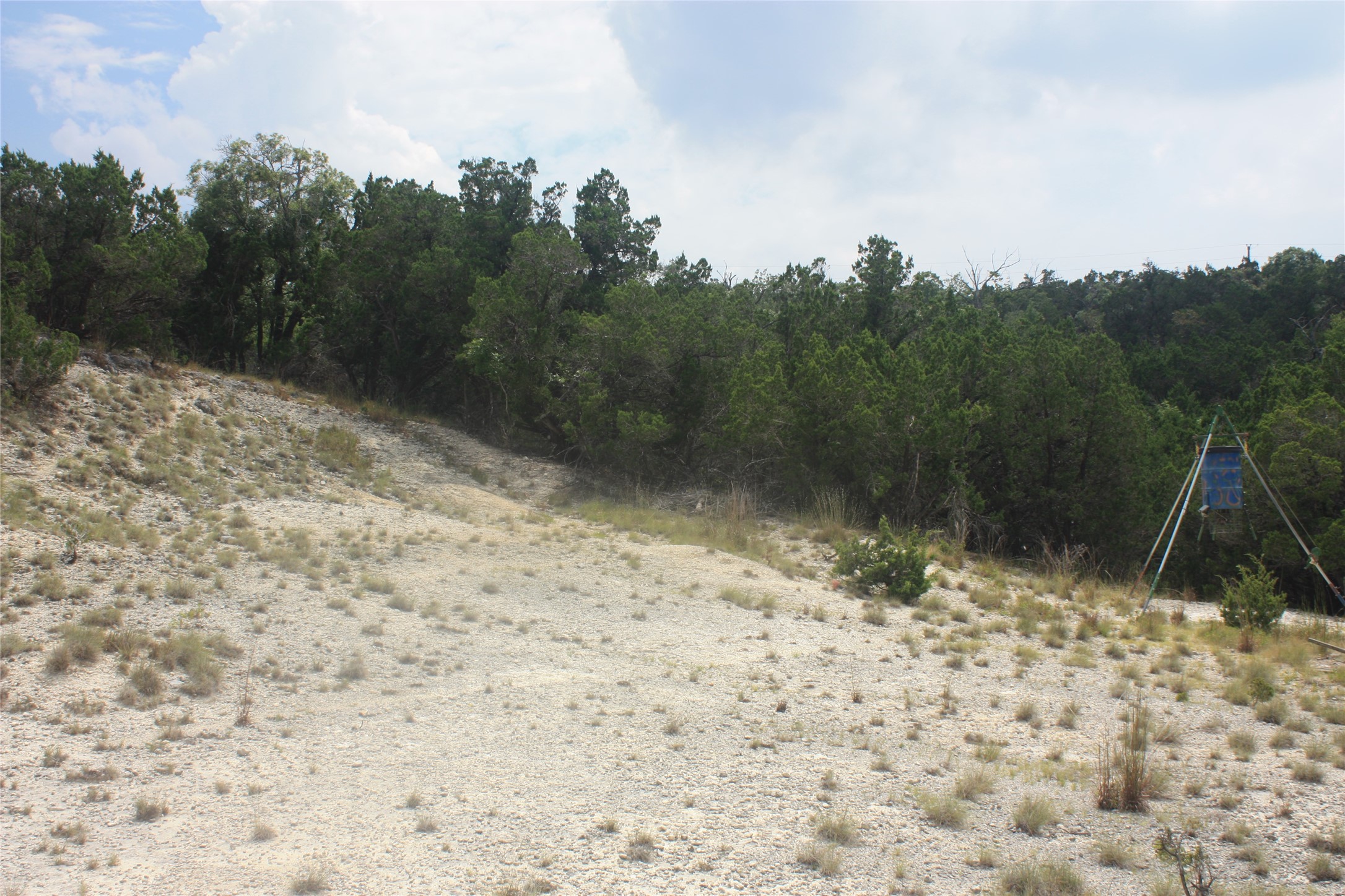 306 West Headwaters Ranch Road Kendalia, TX 78027 - Photo 6 of 9 End of the path leads to an open area and one of the feeders.