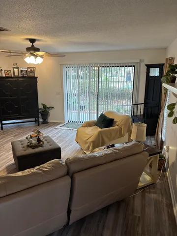 a living room with furniture and flat screen tv
