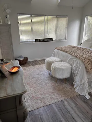 a bedroom with a bed and a table in it