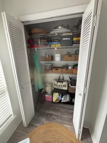 a room with water heater and shelf
