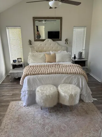 a bedroom with a bed and a couch