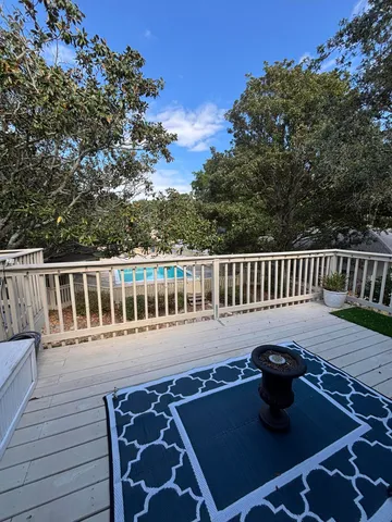 a view of a deck patio and outdoor dining space