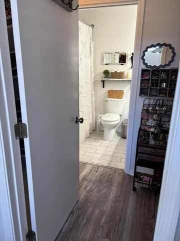 a view of a bathroom with a sink and a mirror