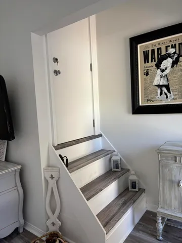 a view of staircase with white walls