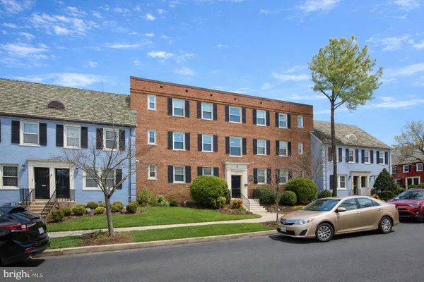 a city street lined with buildings and cars