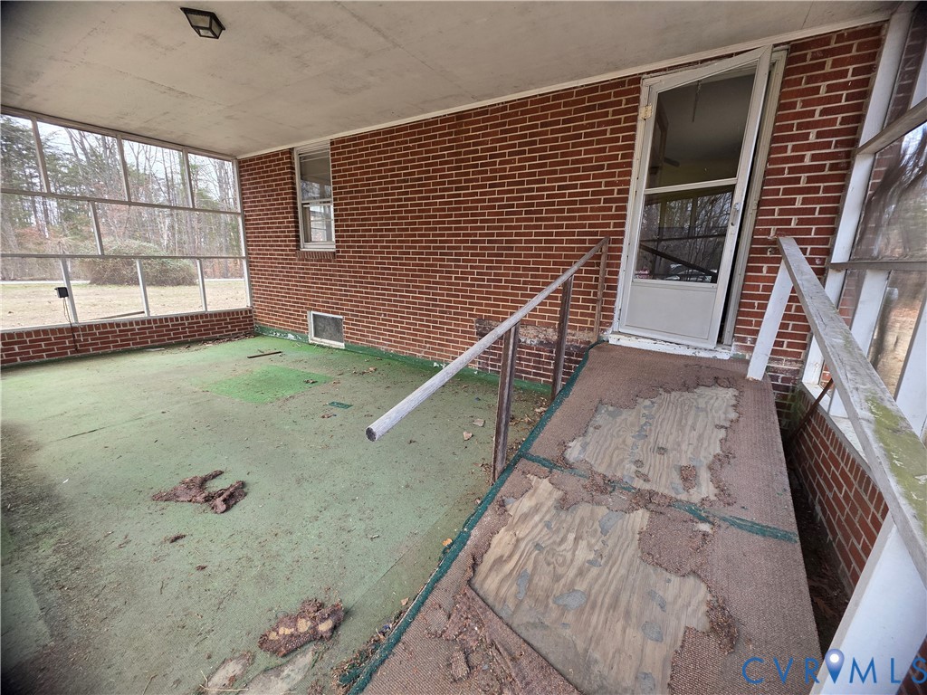 1429 Taro Road Cullen, VA 23934 - Photo 22 of 23 a view of a livingroom with wooden floor and windows