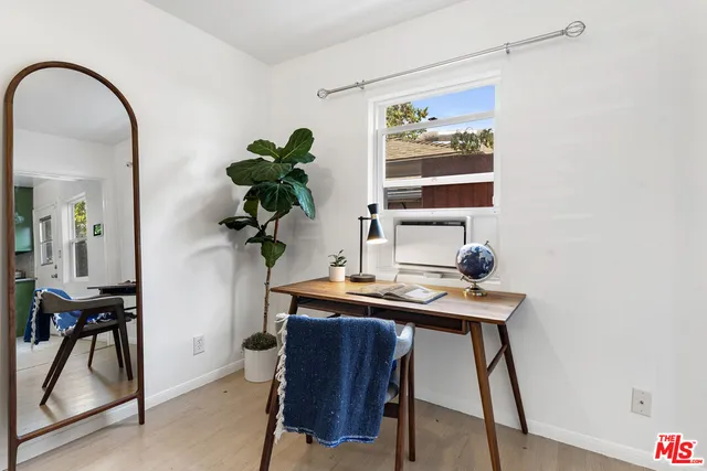 a view of a workspace with furniture