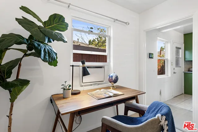 a view of a workspace with furniture
