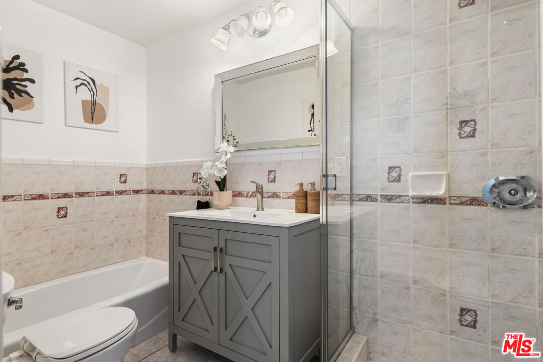 1205 Appleton Way Venice, CA 90291 - Photo 30 of 52 a bathroom with a bathtub sink mirror vanity and toilet