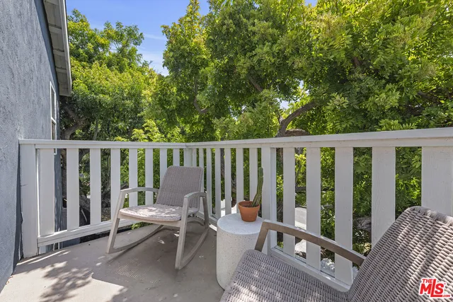 a view of a hallway with washer and dryer