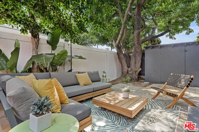 a view of backyard with outdoor seating