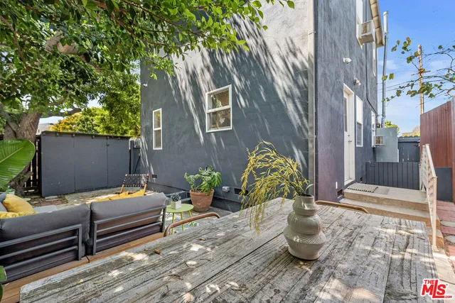 a view of a couches in the patio and a fountain