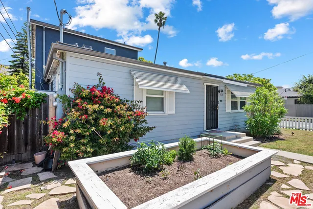 a kitchen with stainless steel appliances a refrigerator sink and stove