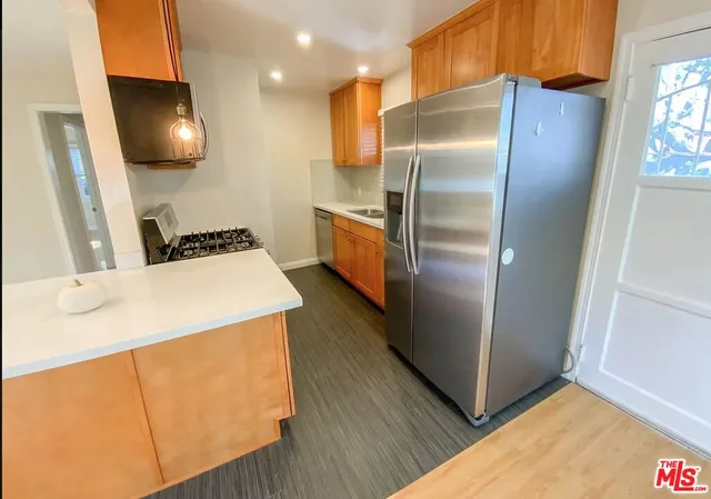 a kitchen with a stove and a microwave