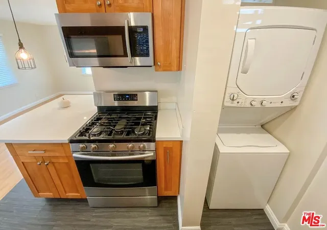 a kitchen with a sink and a window
