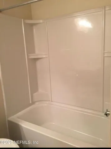 a bathroom with a bathtub
