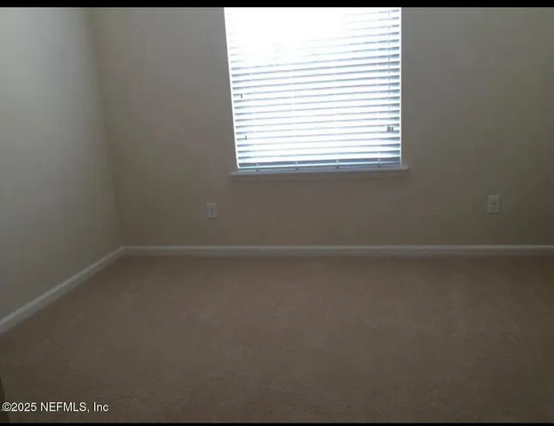 a view of a room that has a window in it