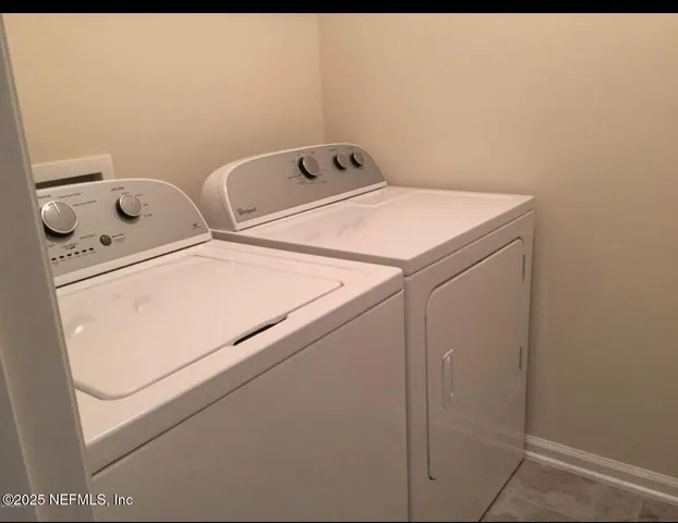 a utility room with dryer and washer
