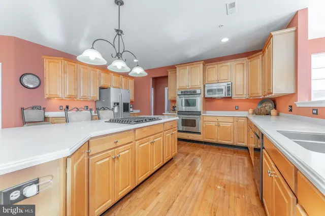 a bathroom with a sink toilet and mirror