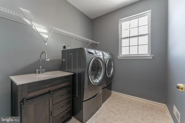 a living room with furniture a ceiling fan and a window