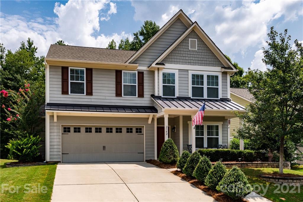 2142 Bluebell Way Tega Cay, SC 29708 - Photo 1 of 48 a front view of a house with a yard