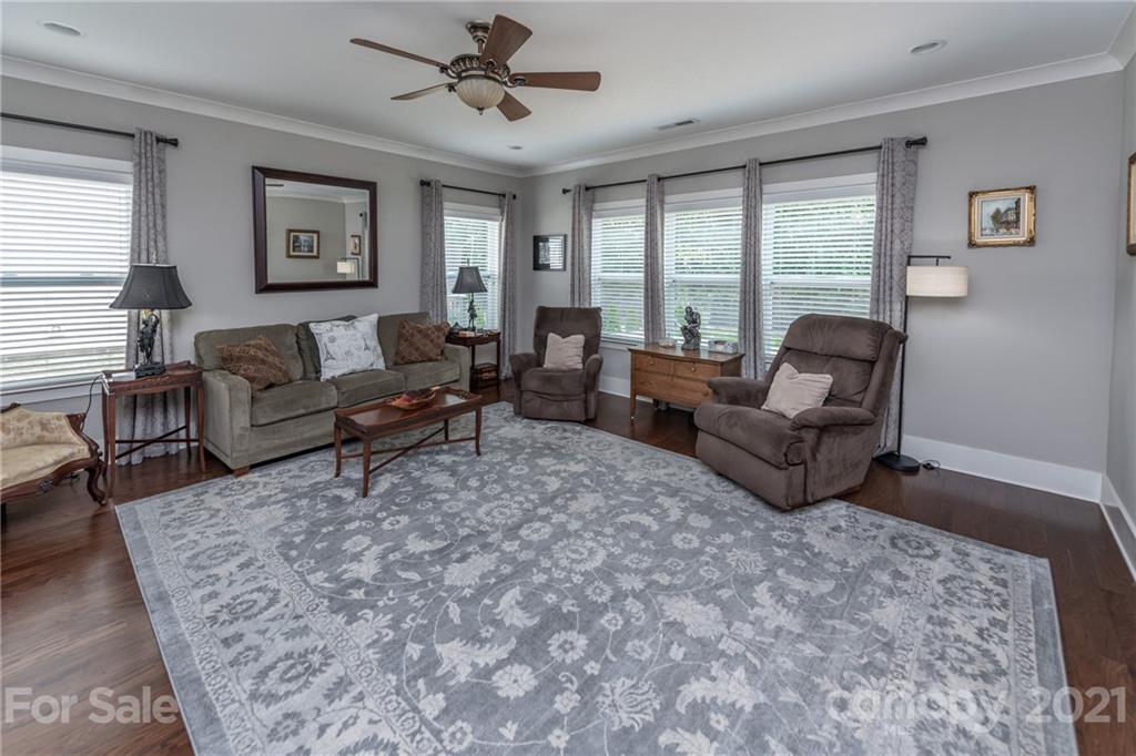 2142 Bluebell Way Tega Cay, SC 29708 - Photo 15 of 48 a living room with furniture and a large window