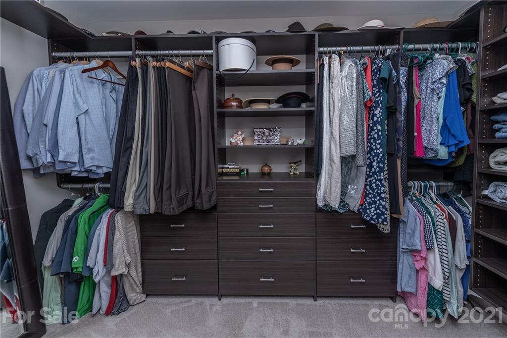2142 Bluebell Way Tega Cay, SC 29708 - Photo 28 of 48 a view of walk in closet with clothes and shoes