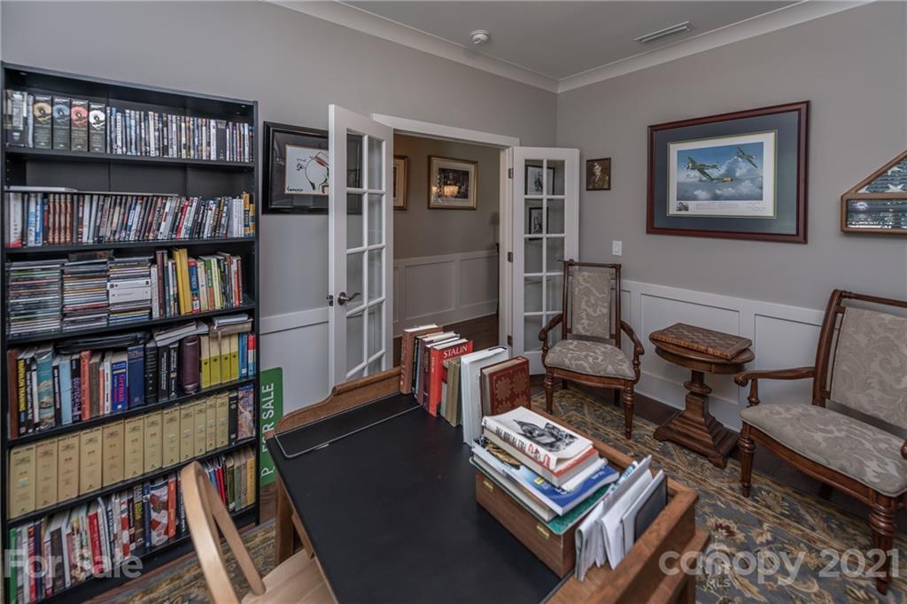 2142 Bluebell Way Tega Cay, SC 29708 - Photo 4 of 48 a living room with furniture and a book shelf
