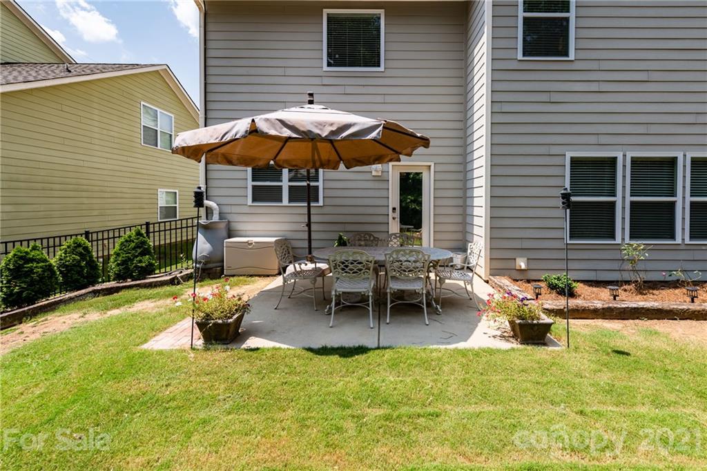2142 Bluebell Way Tega Cay, SC 29708 - Photo 36 of 48 a backyard of a house with seating space