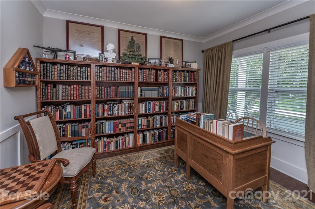 2142 Bluebell Way Tega Cay, SC 29708 - Photo 5 of 48 a living room with furniture and a book shelf