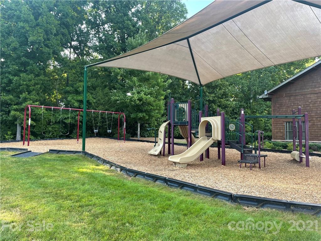 2142 Bluebell Way Tega Cay, SC 29708 - Photo 41 of 48 a view of a park with slide