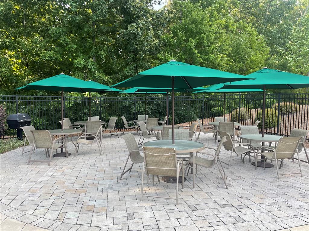 2142 Bluebell Way Tega Cay, SC 29708 - Photo 46 of 48 a patio with a patio table and chairs