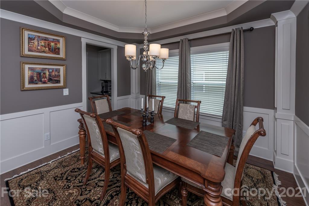 2142 Bluebell Way Tega Cay, SC 29708 - Photo 7 of 48 a view of a dining room with furniture window and wooden floor