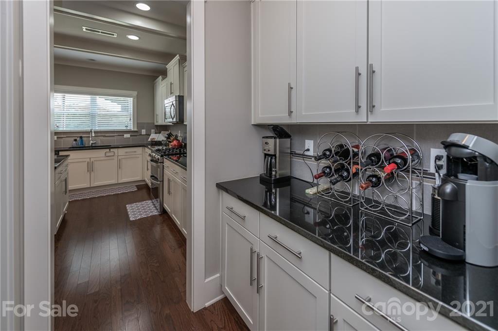 2142 Bluebell Way Tega Cay, SC 29708 - Photo 8 of 48 a kitchen with a sink and cabinets