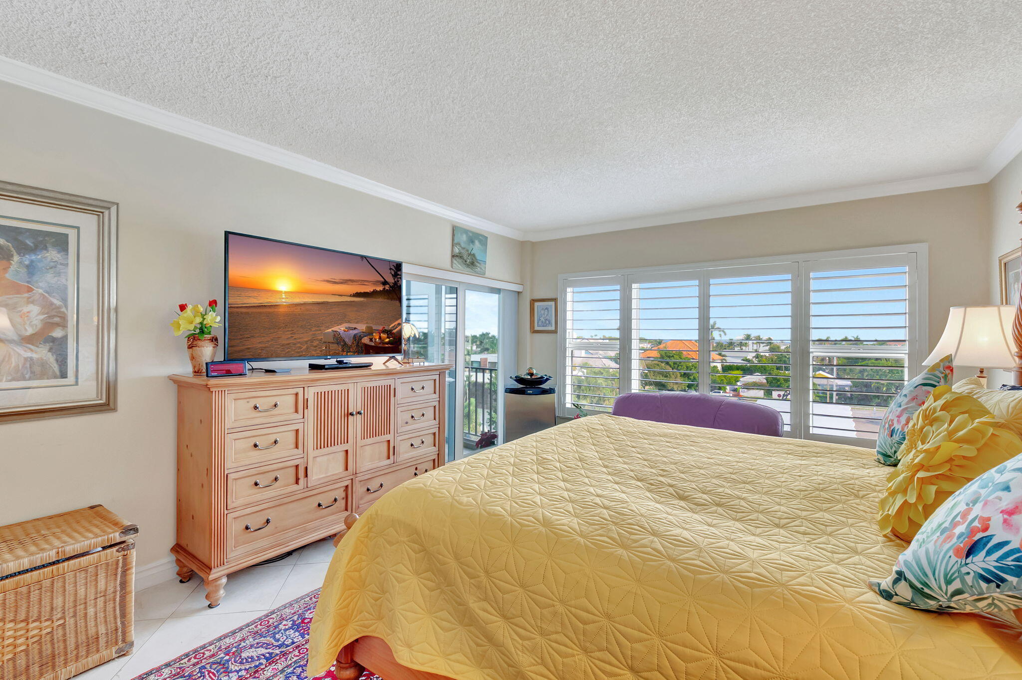 220 Mac Farlane Drive, Unit S505 Delray Beach, FL 33483 - Photo 33 of 72 a bedroom with a bed and a flat screen tv