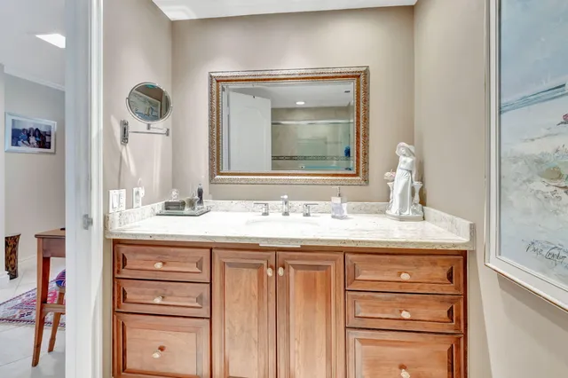 a living room with furniture and large windows