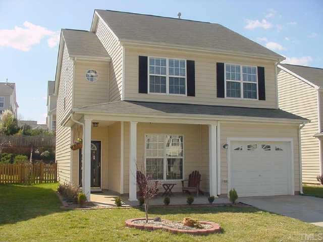 a front view of a house with a swimming pool