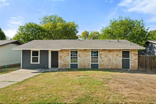 front view of a house with a yard