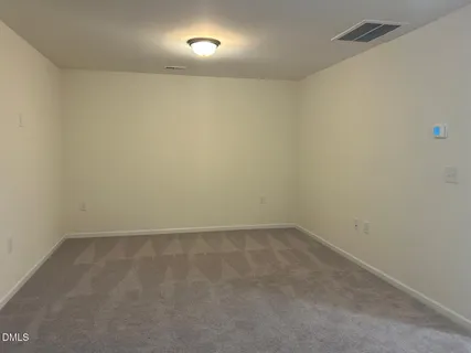 an empty room with a bench