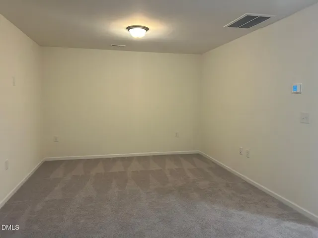 an empty room with a bench