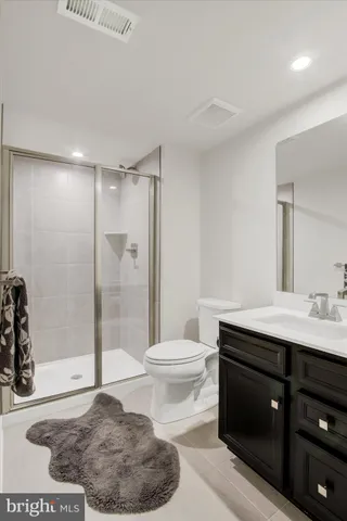 a view of a room with furniture and a window