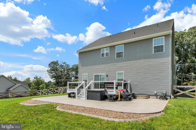 a view of yard with swimming pool and trees