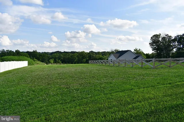 a view of a house with a big yard