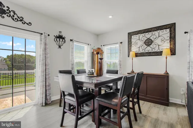 a view of a dining room with furniture and window