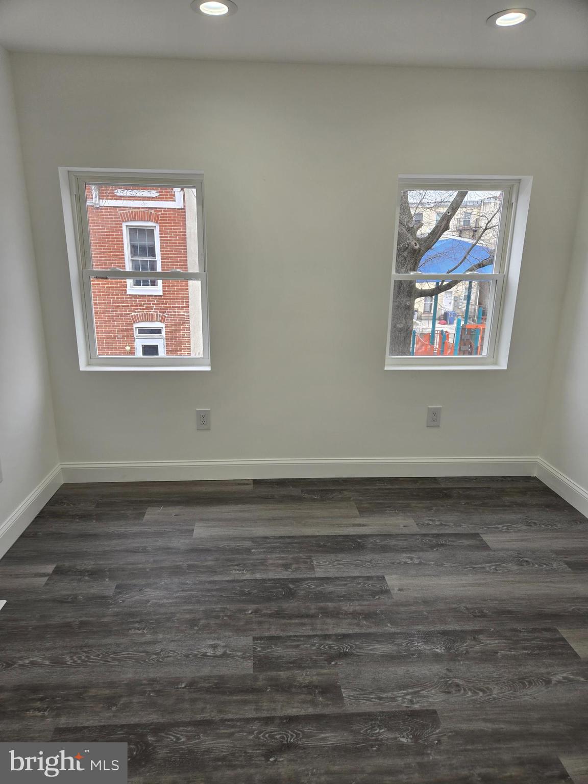 2008 Etting Street Baltimore, MD 21217 - Photo 11 of 22 a view of an empty room with wooden floor and a window
