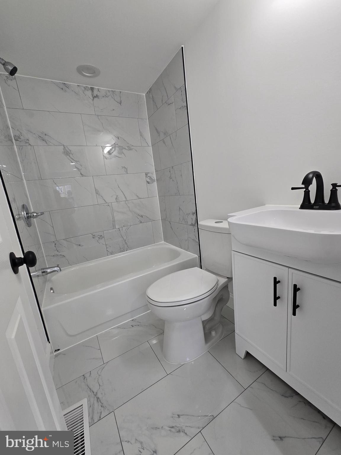 2008 Etting Street Baltimore, MD 21217 - Photo 13 of 22 a bathroom with a toilet and a bath tub