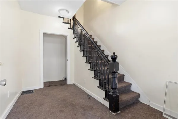 a view of entryway with a front door